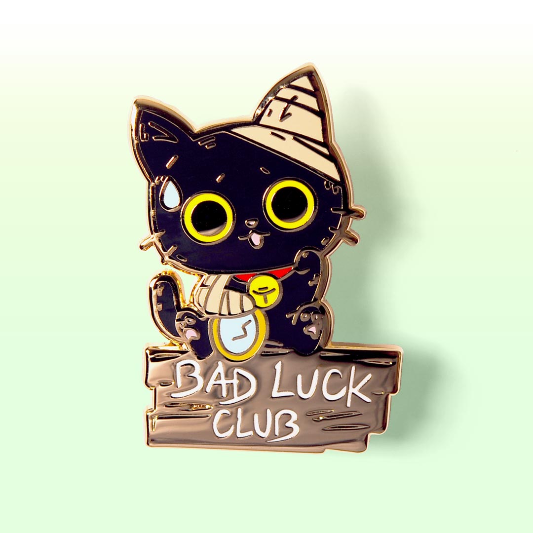 Badge, pin Black cat with a knife - . Gift Ideas